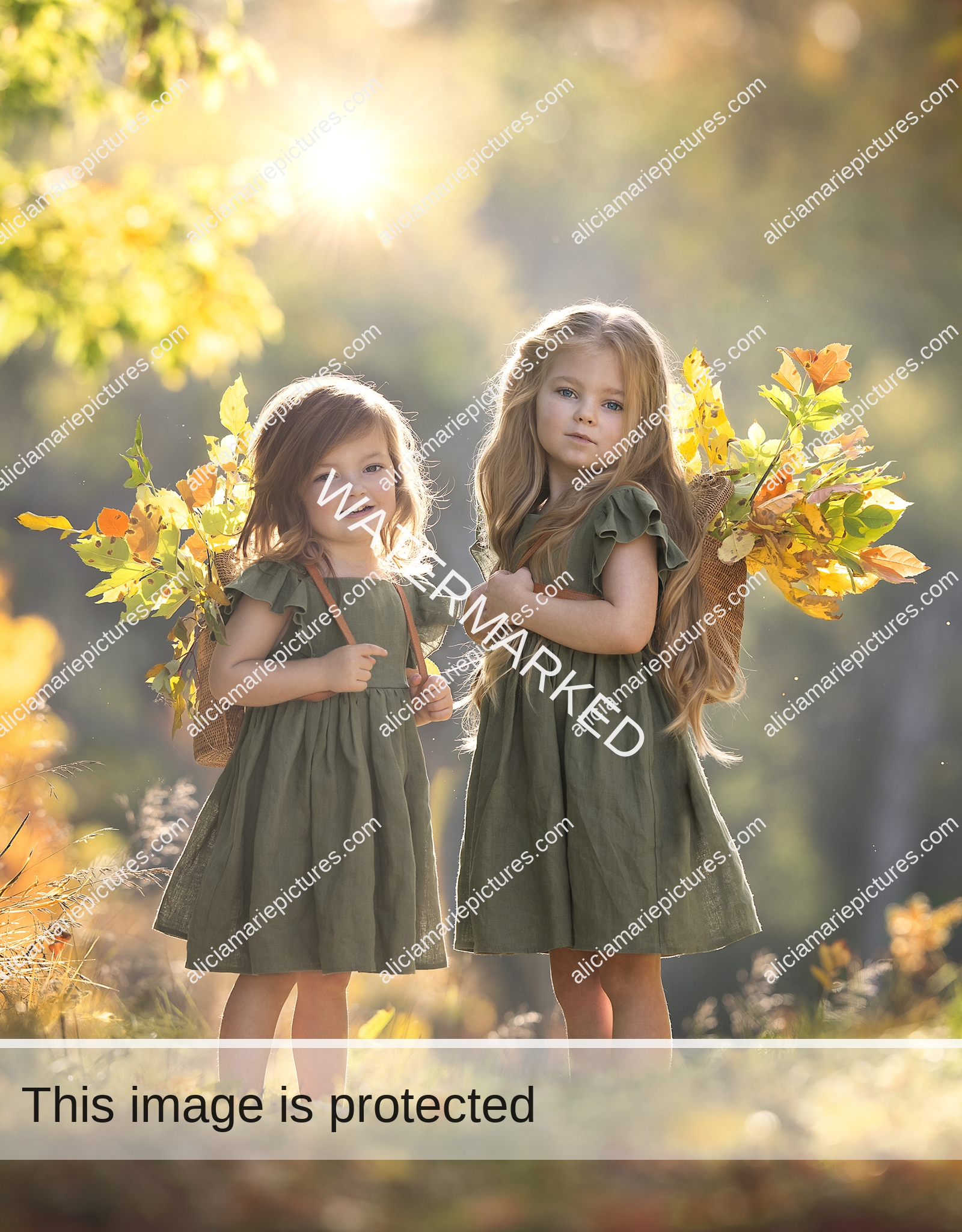 Fine art photography two little girls sisters with rattan backpacks carrying autumn leaves at golden hour