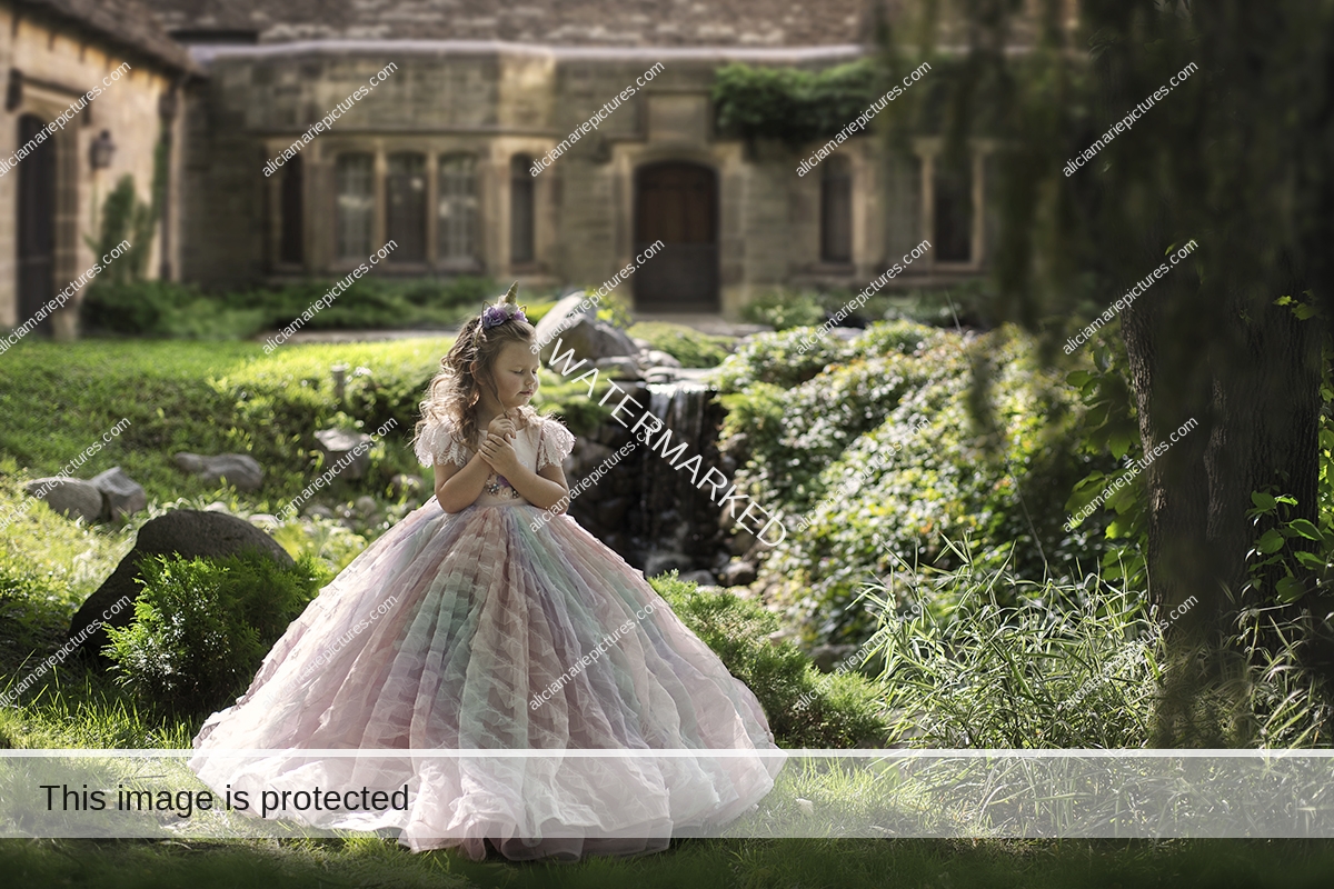 Young girl in fancy couture dress greenery park castle royalty unicorn rainbow