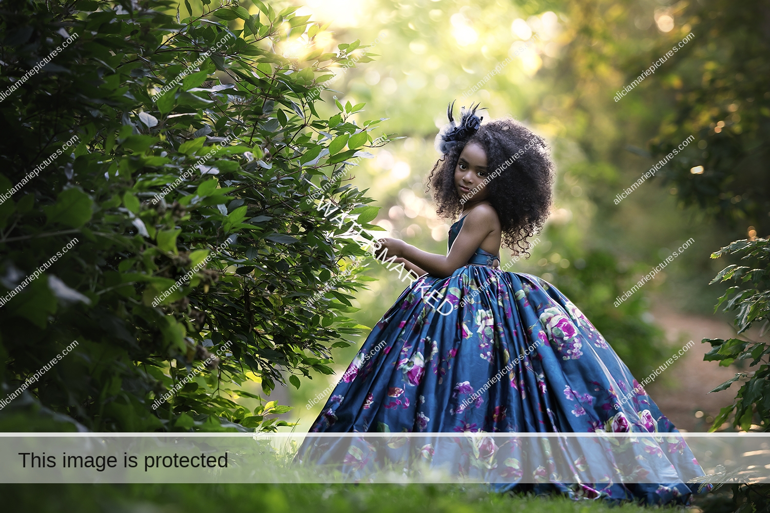 Fine art photography young girl standing in couture dress by leaves at golden hour