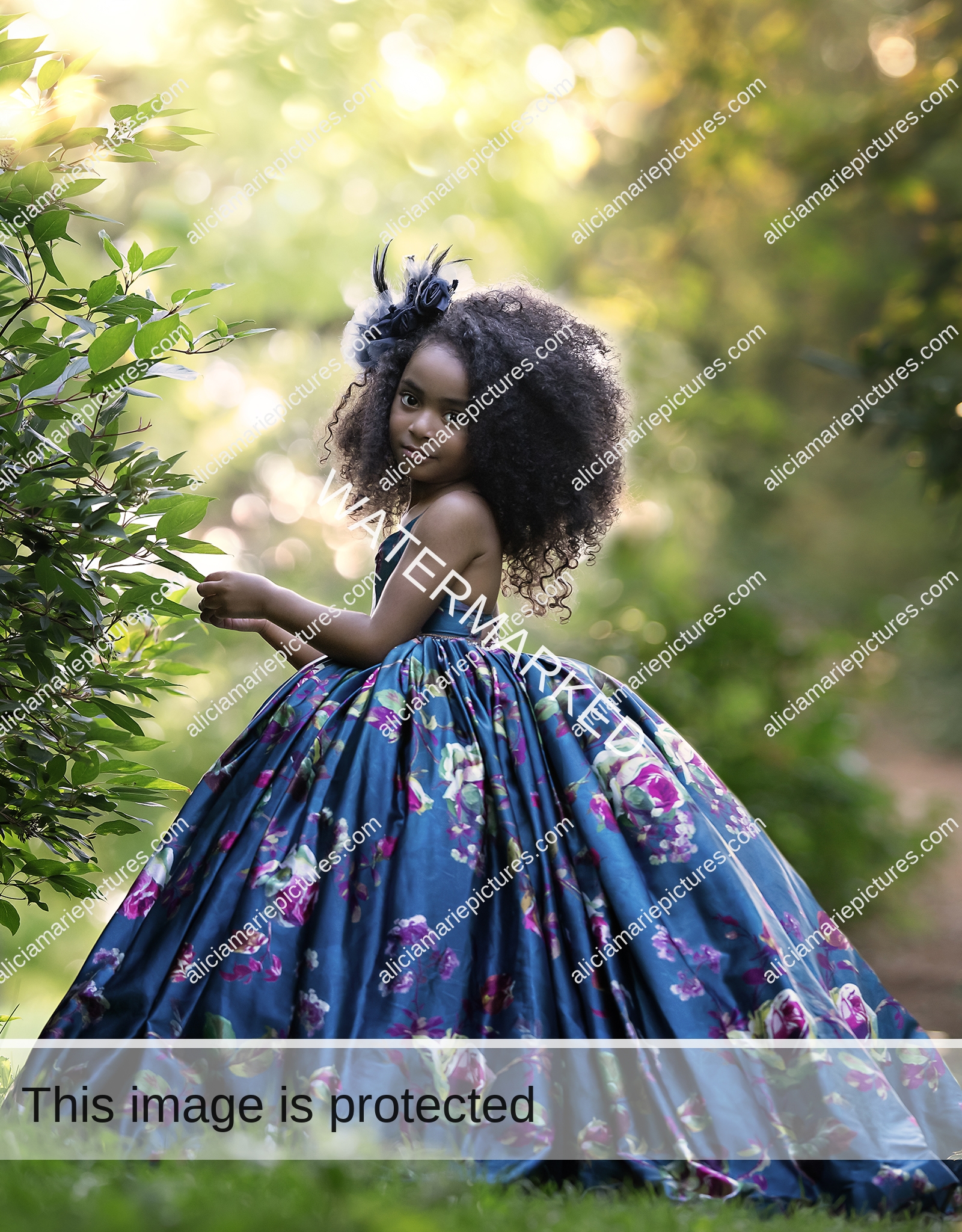 Fine art photography young girl standing in couture dress by leaves at golden hour