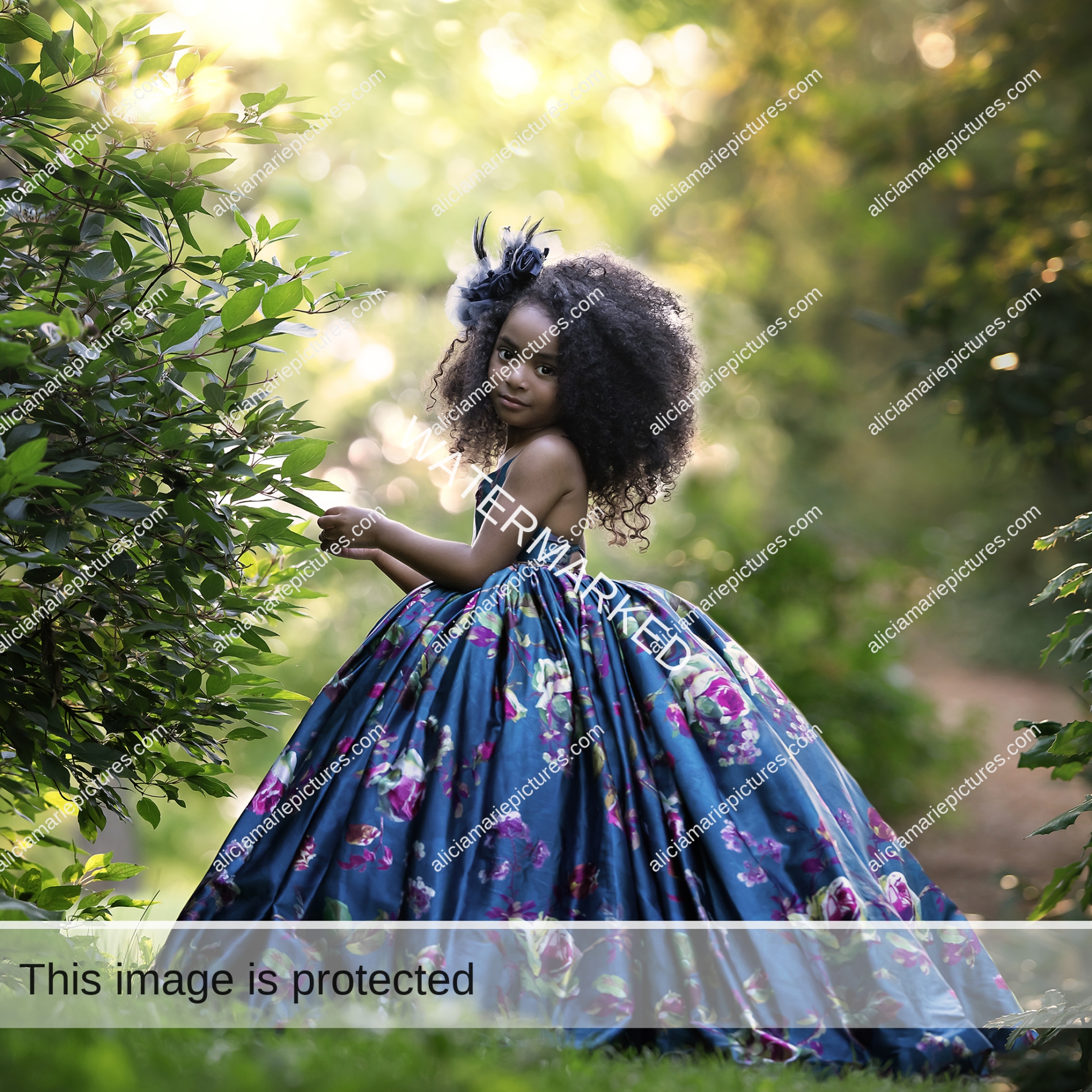 Fine art photography young girl standing in couture dress by leaves at golden hour