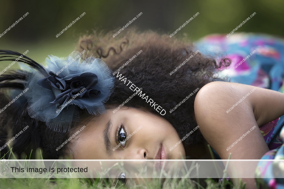 black girl laying in grass. Editorial luxury couture fine art photography. Fargo north dakota